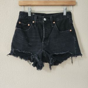 Levi's 501 Original high-rise black distressed denim cut-off shorts.